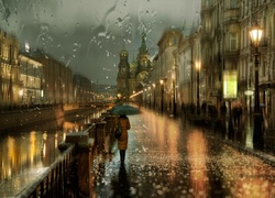 Kobieta z parasolem na oświetlonej ulicy w deszczu