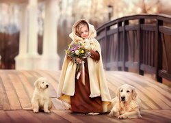 Dziewczynka z psami golden retrievera