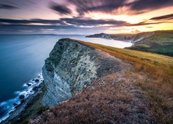 Wybrzeże, Gad Cliff, Klif, Morze, Zachód słońca, Trawy, Chmury, Hrabstwo Dorset, Anglia