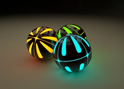 Trzy kolorowe świecące kule w grafice 3D